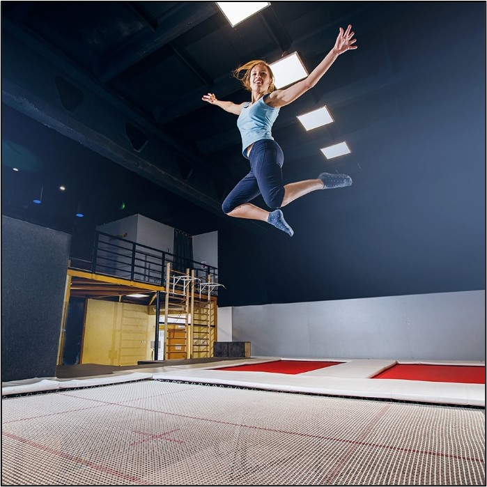 lady jumping on trampoline